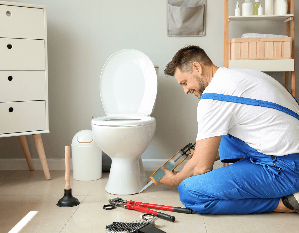 Native Plumbing LLC plumber installing bathroom sink fixtures in Jefferson County, Tennessee.
