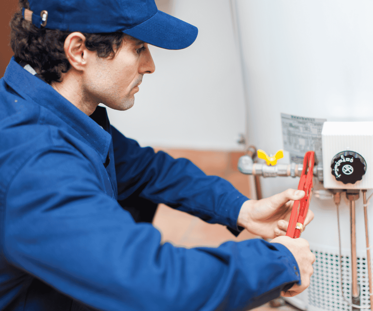 Native Plumbing LLC technician in Jefferson County, TN performing a water heater service step.