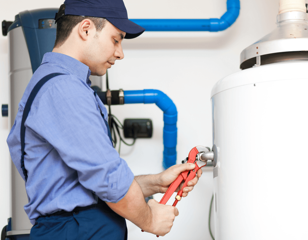 Native Plumbing LLC technician performing water heater maintenance and repairs in Jefferson County, Tennessee.