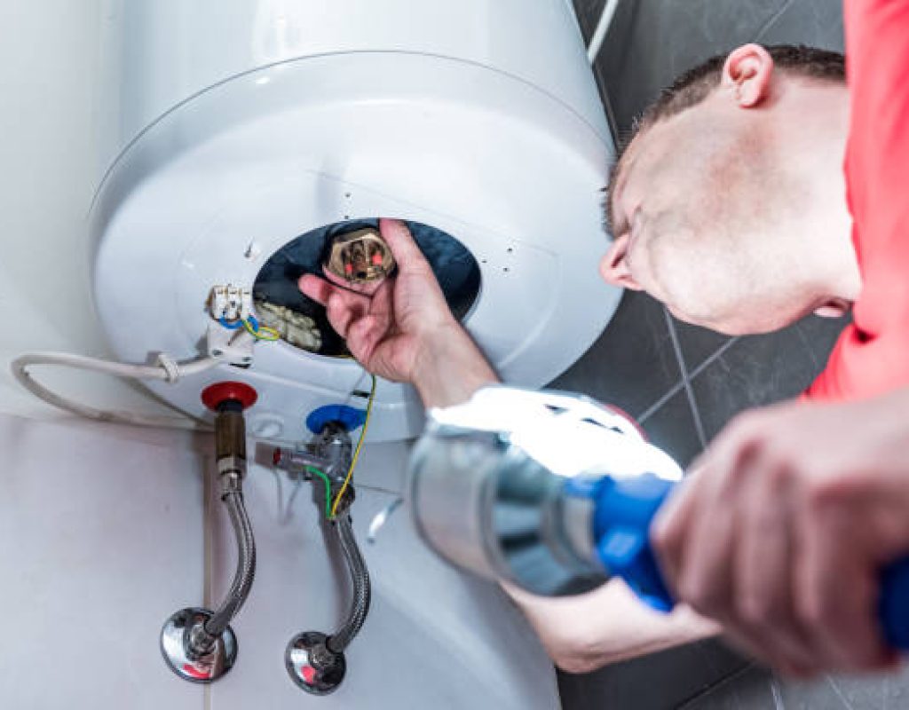 Native Plumbing LLC replacing outdated water heater in residential home