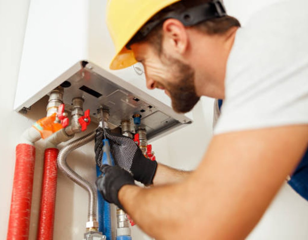 Native Plumbing LLC installing tankless water heater in home property