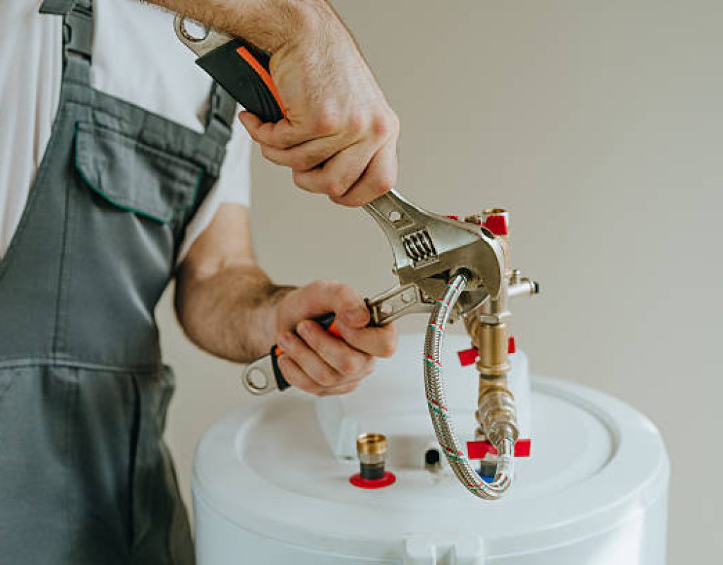 Plumber from Native Plumbing LLC fixing leaking kitchen sink efficiently