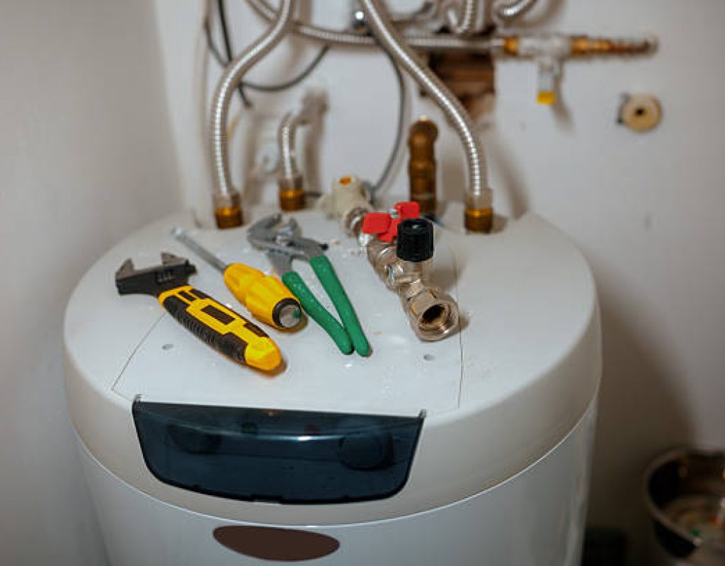 Native Plumbing LLC performing emergency water heater repair service
